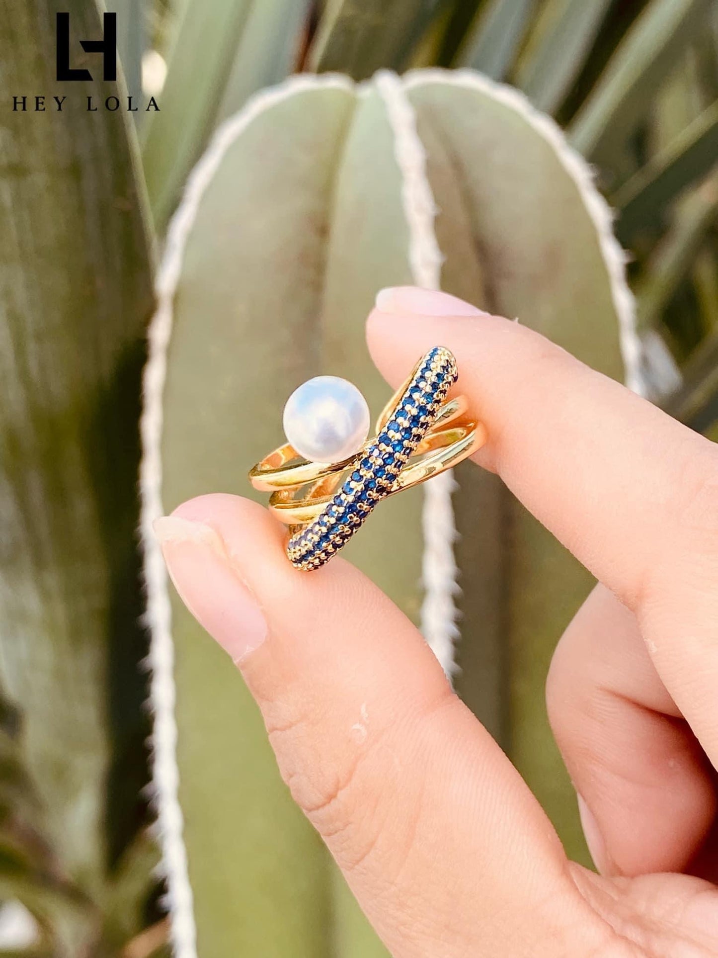 Anillos cruzados con perla y circonias de colores