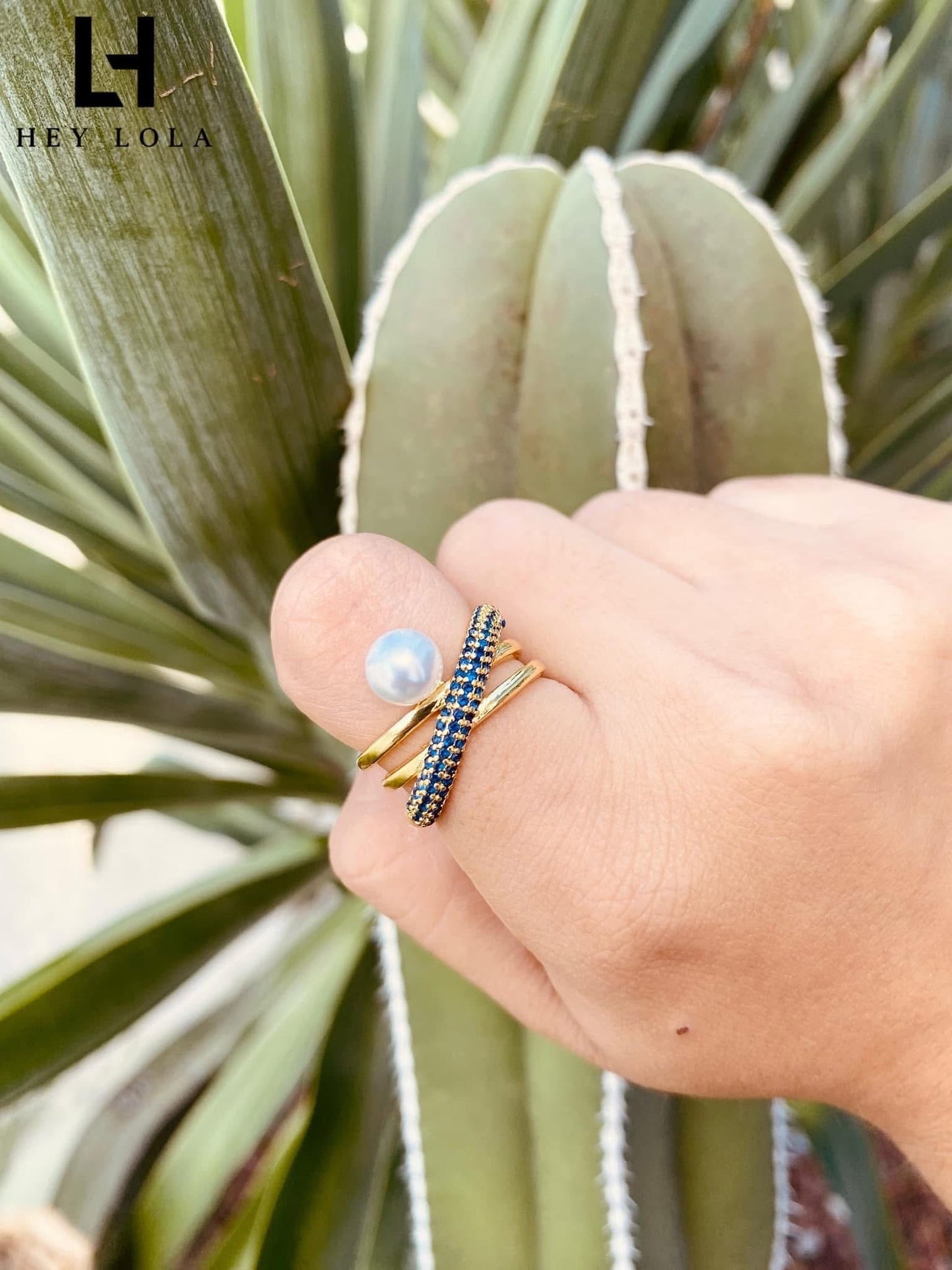 Anillos cruzados con perla y circonias de colores