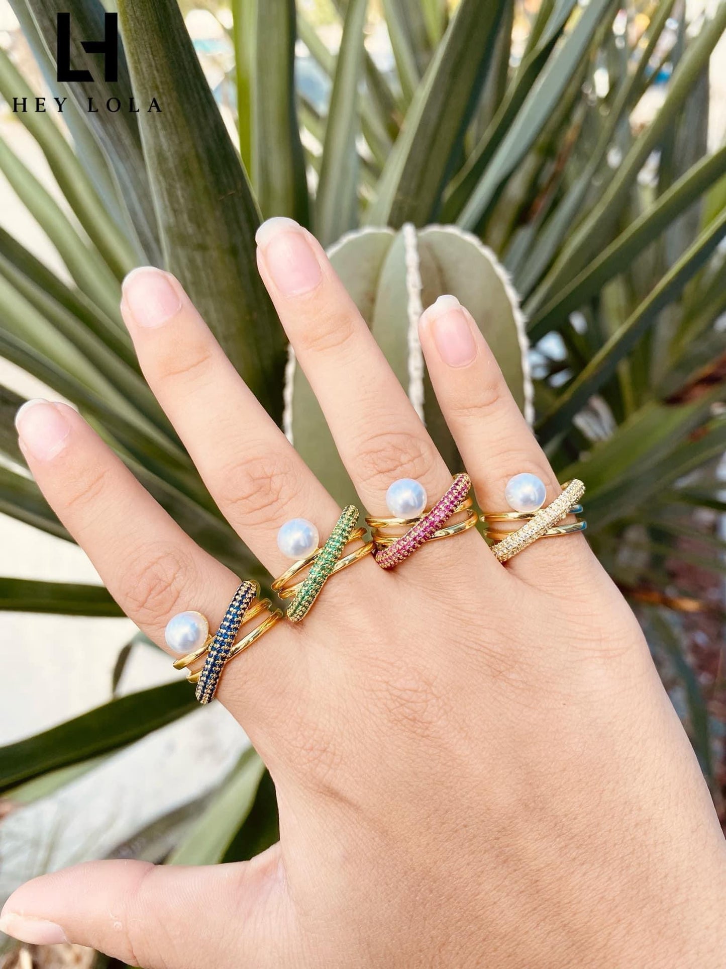 Anillos cruzados con perla y circonias de colores